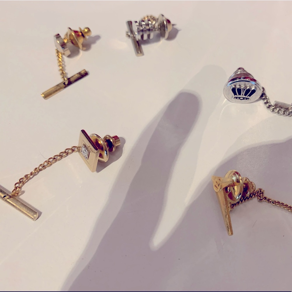 Five tie clips.